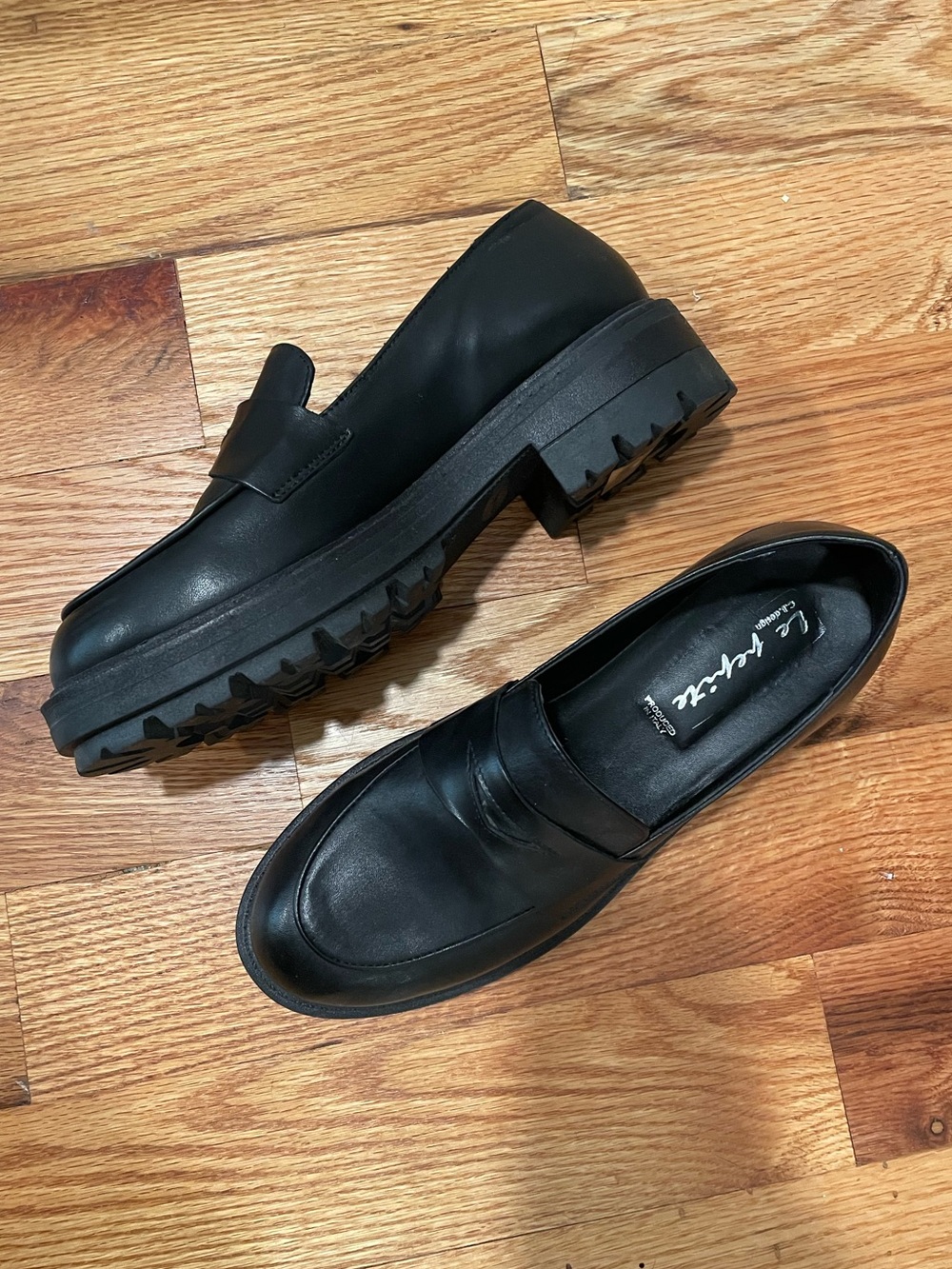 Women’s Black Leather Lug Sole Penny Loafers